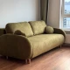 Диван оливкового кольору з округлими формами