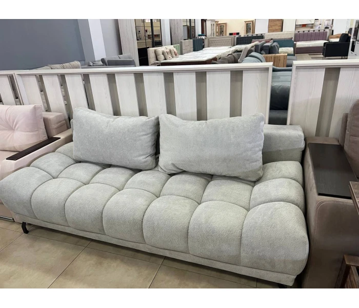 Диван-софа с фактурной обивкой и большими подушками