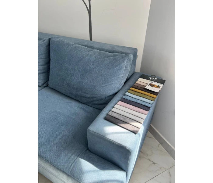 Блакитний кутовий диван з широким шезлонгом