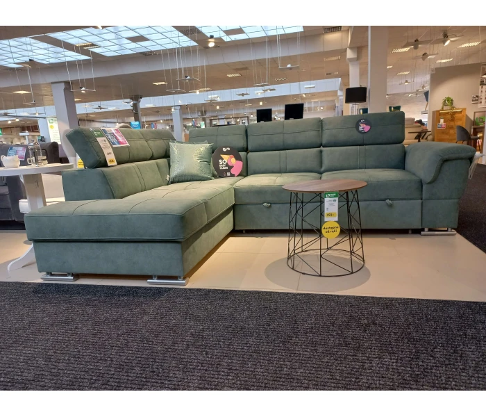 Современный угловой диван зелёного цвета с раскладным механизмом.
