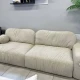Двухместный бежевый диван с глубокой посадкой