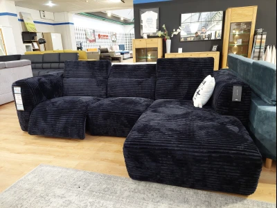 Секционный диван с глубоким сиденьем и объемными подушками.