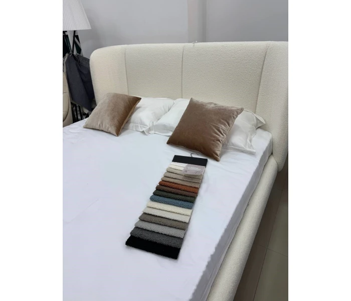 Ліжко з високим об'ємним узголів'ям радіусної форми