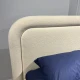 Двуспальная кровать с округлым мягким изголовьем