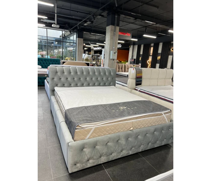 Текстильне ліжко у велюрі з об'ємним стьобанням